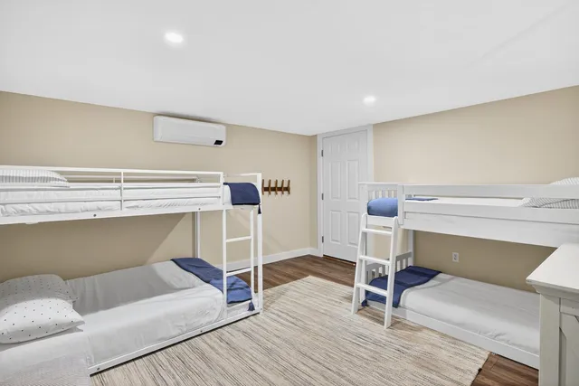 a bedroom with a bed and a chair