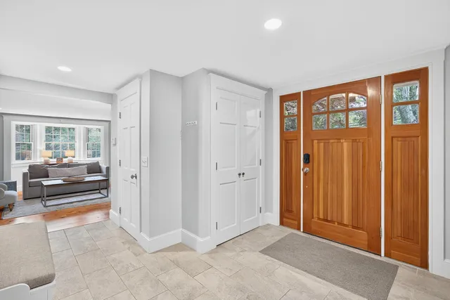 a view of a livingroom with furniture and a window