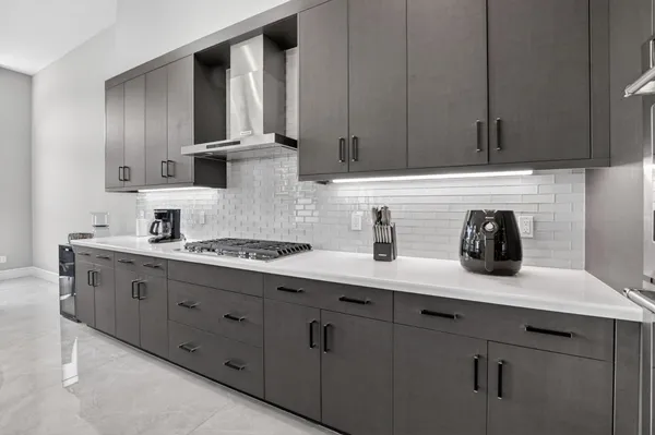 a dining room with furniture and a floor to ceiling window