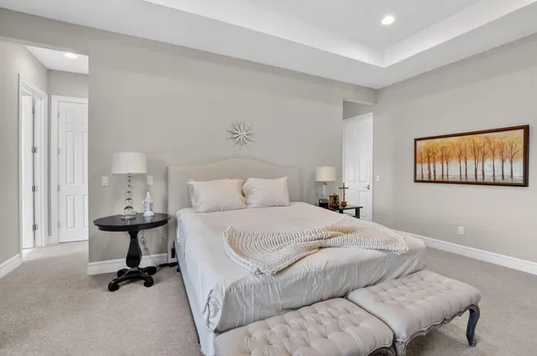 a bedroom with a bed and a dresser