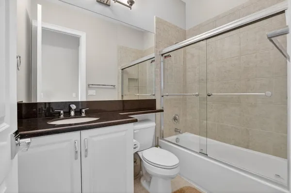 a aerial view of a house with garden space and lake view