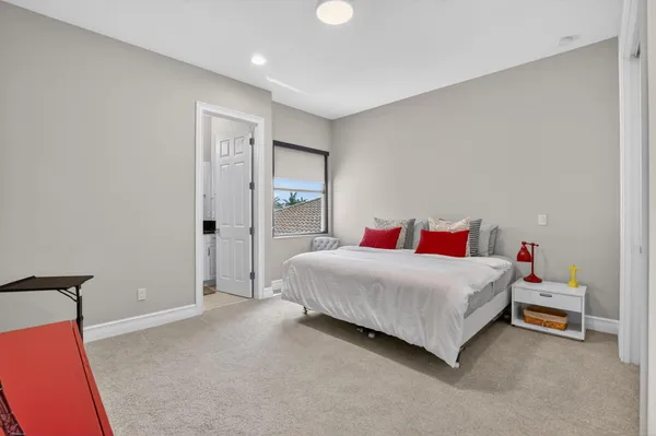 an aerial view of residential houses with outdoor space and swimming pool