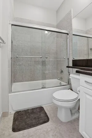 an aerial view of a house with a garden and outdoor seating