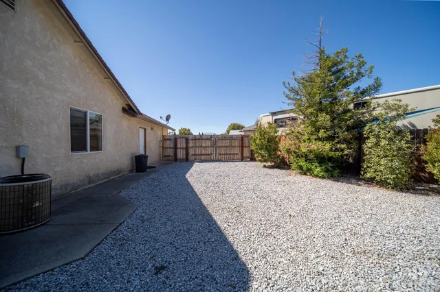 a house view with a backyard space