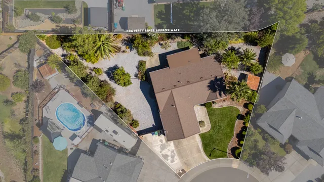 an aerial view of a house with outdoor space