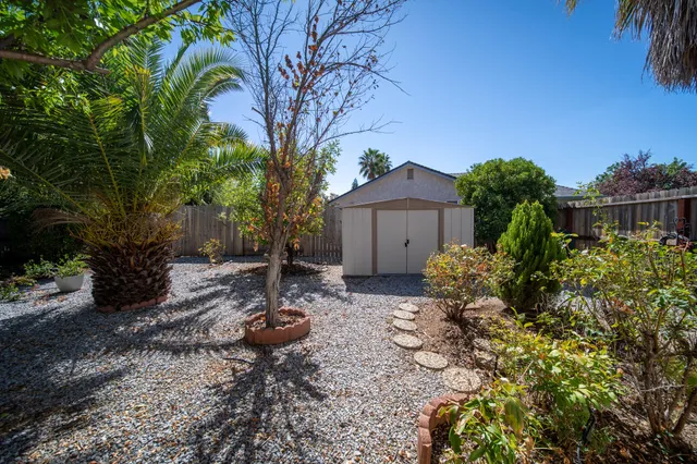 a backyard of a house with lots of green space