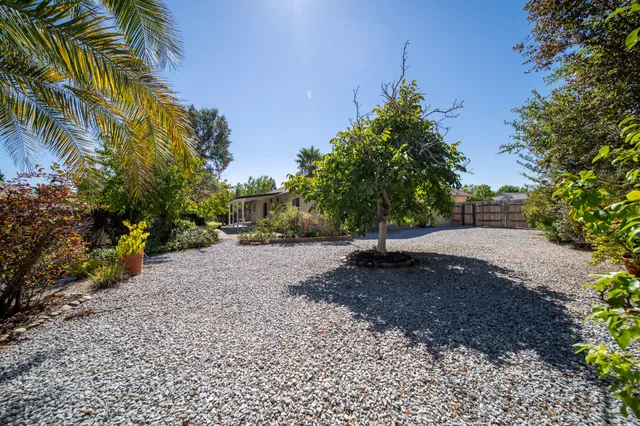 a backyard of a house with lots of green space