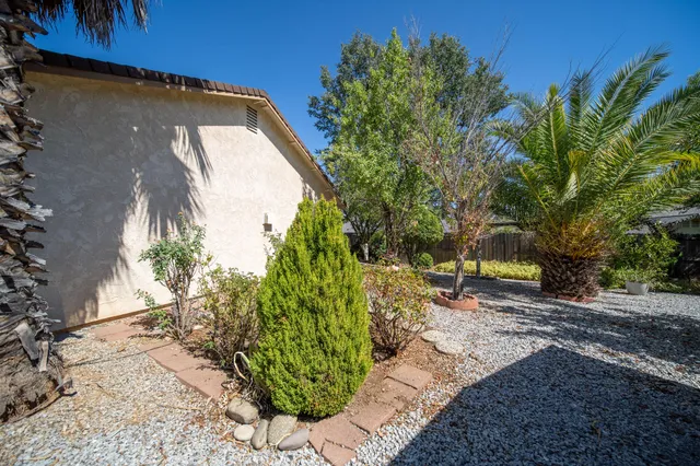 a backyard of a house with outdoor seating