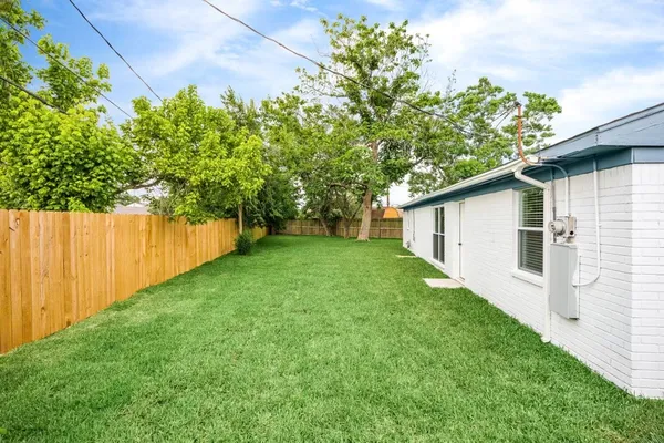 a backyard of a house with lots of green space
