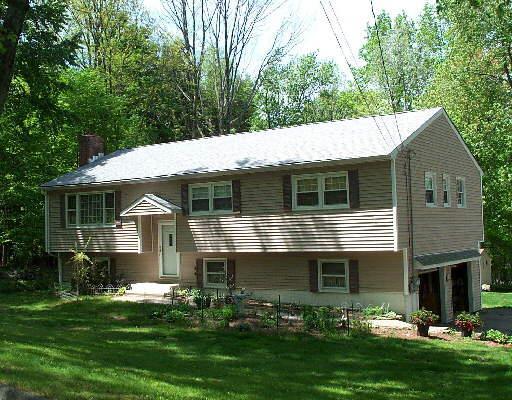 4 Fairchild Road Newtown, CT 06470 - Photo 1 of 1 a front view of house with yard and green space