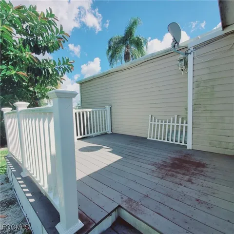 a view of a porch with wooden floor