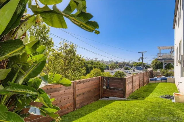 a view of a backyard with sitting area