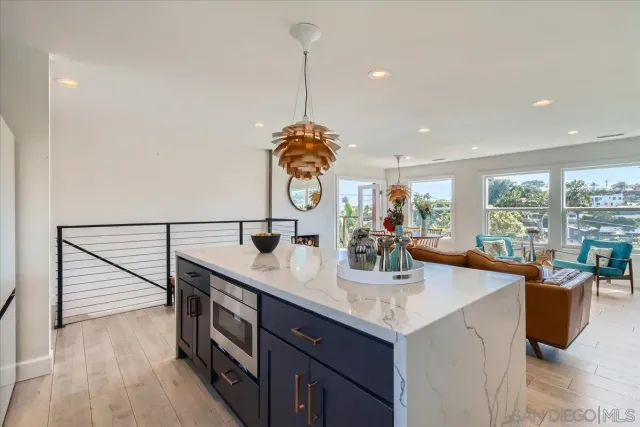 a kitchen with counter top space appliances and cabinets