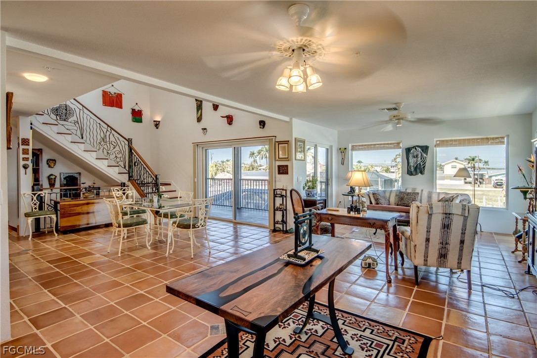 2702 Bruce Street Matlacha, FL 33993 - Photo 13 of 50 a living room with lots of furniture and a chandelier