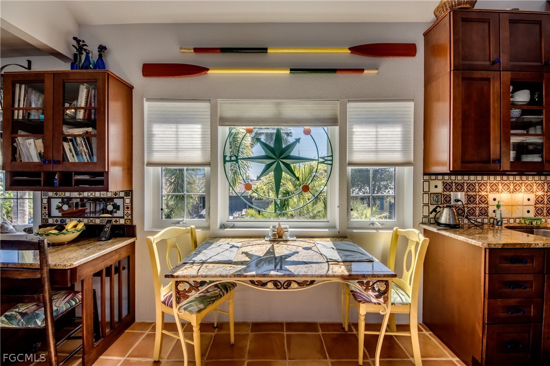 2702 Bruce Street Matlacha, FL 33993 - Photo 16 of 50 a view of a dining room with furniture window and outside view