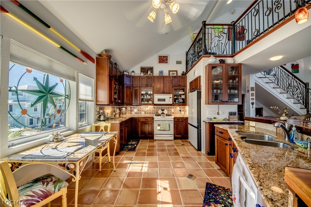 2702 Bruce Street Matlacha, FL 33993 - Photo 17 of 50 a kitchen with a stove a refrigerator and a stove