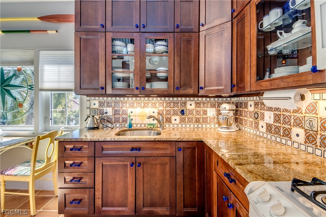 2702 Bruce Street Matlacha, FL 33993 - Photo 18 of 50 a bathroom with a sink a vanity and a window