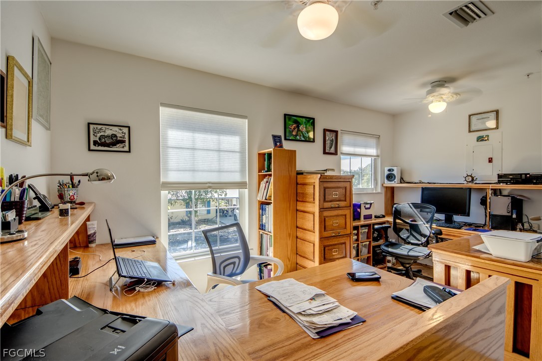 2702 Bruce Street Matlacha, FL 33993 - Photo 25 of 50 a living room with furniture and a flat screen tv