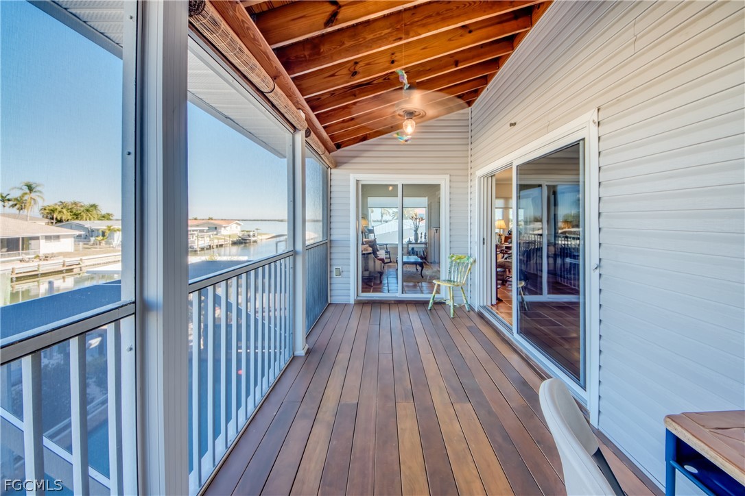 2702 Bruce Street Matlacha, FL 33993 - Photo 29 of 50 a view of a balcony with wooden floor