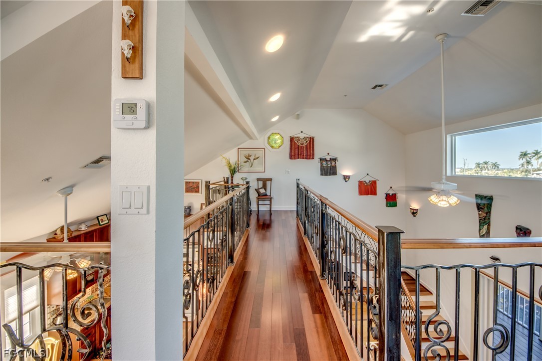 2702 Bruce Street Matlacha, FL 33993 - Photo 30 of 50 a view of a hallway with wooden floor and stairs