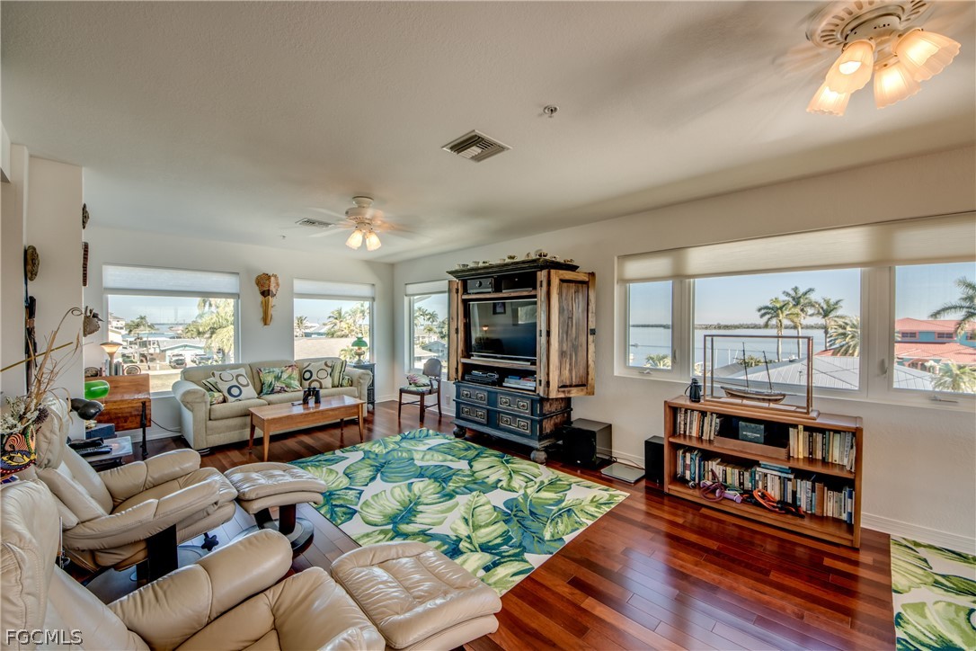 2702 Bruce Street Matlacha, FL 33993 - Photo 32 of 50 a living room with furniture and a flat screen tv