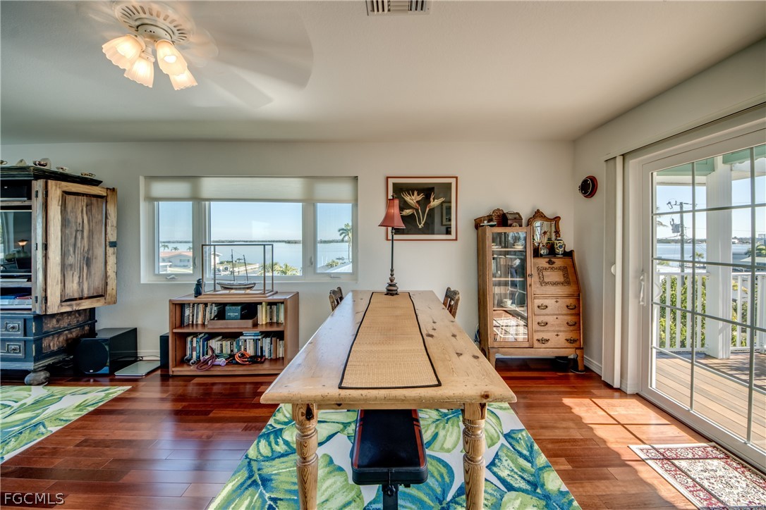 2702 Bruce Street Matlacha, FL 33993 - Photo 33 of 50 a living room with furniture and a flat screen tv