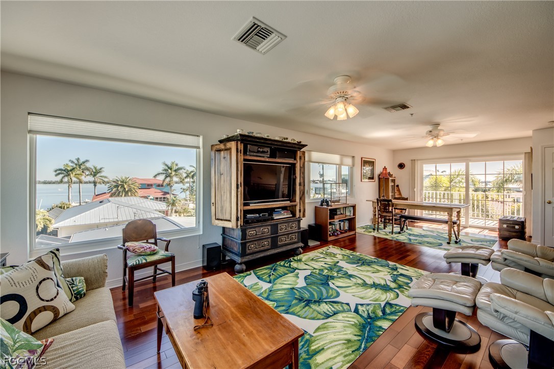 2702 Bruce Street Matlacha, FL 33993 - Photo 35 of 50 a living room with furniture and a flat screen tv