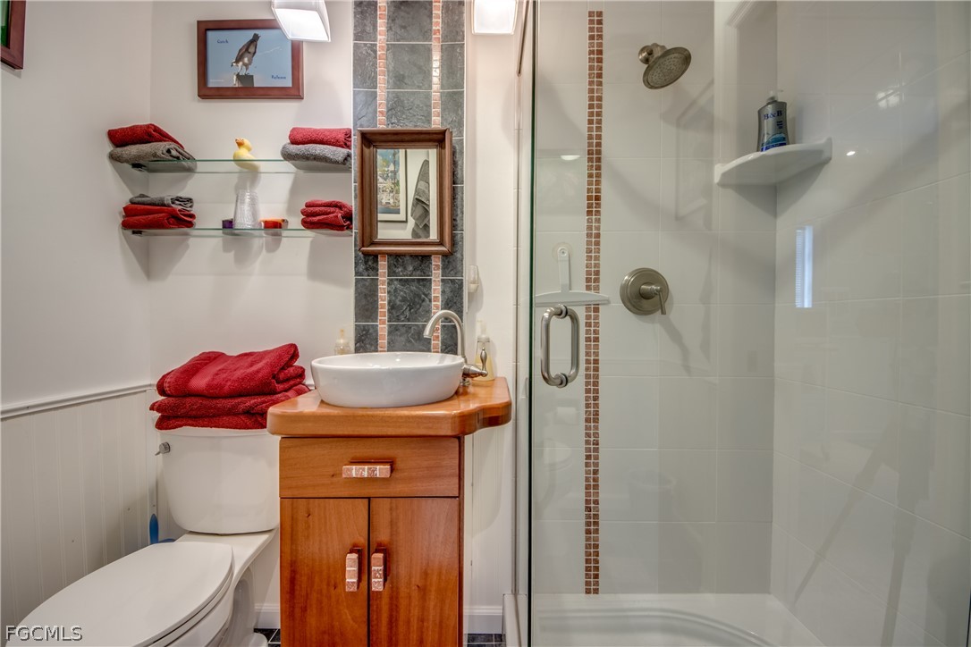 2702 Bruce Street Matlacha, FL 33993 - Photo 43 of 50 a bathroom with a sink toilet and shower