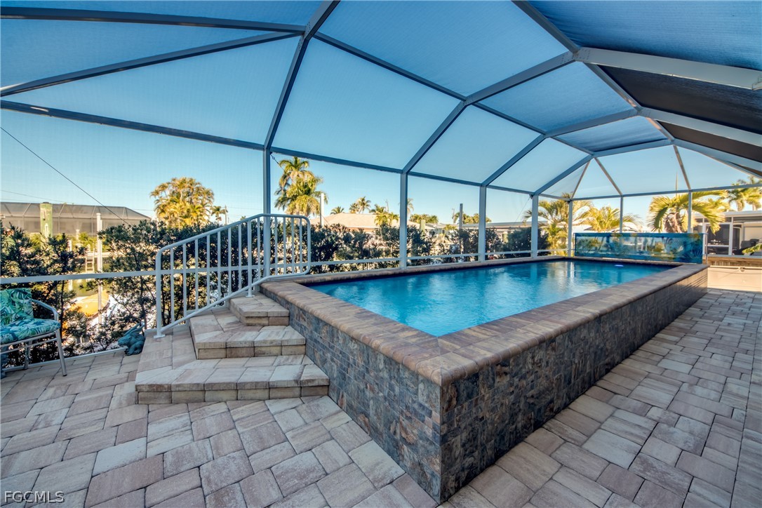2702 Bruce Street Matlacha, FL 33993 - Photo 45 of 50 a view of swimming pool with outdoor seating