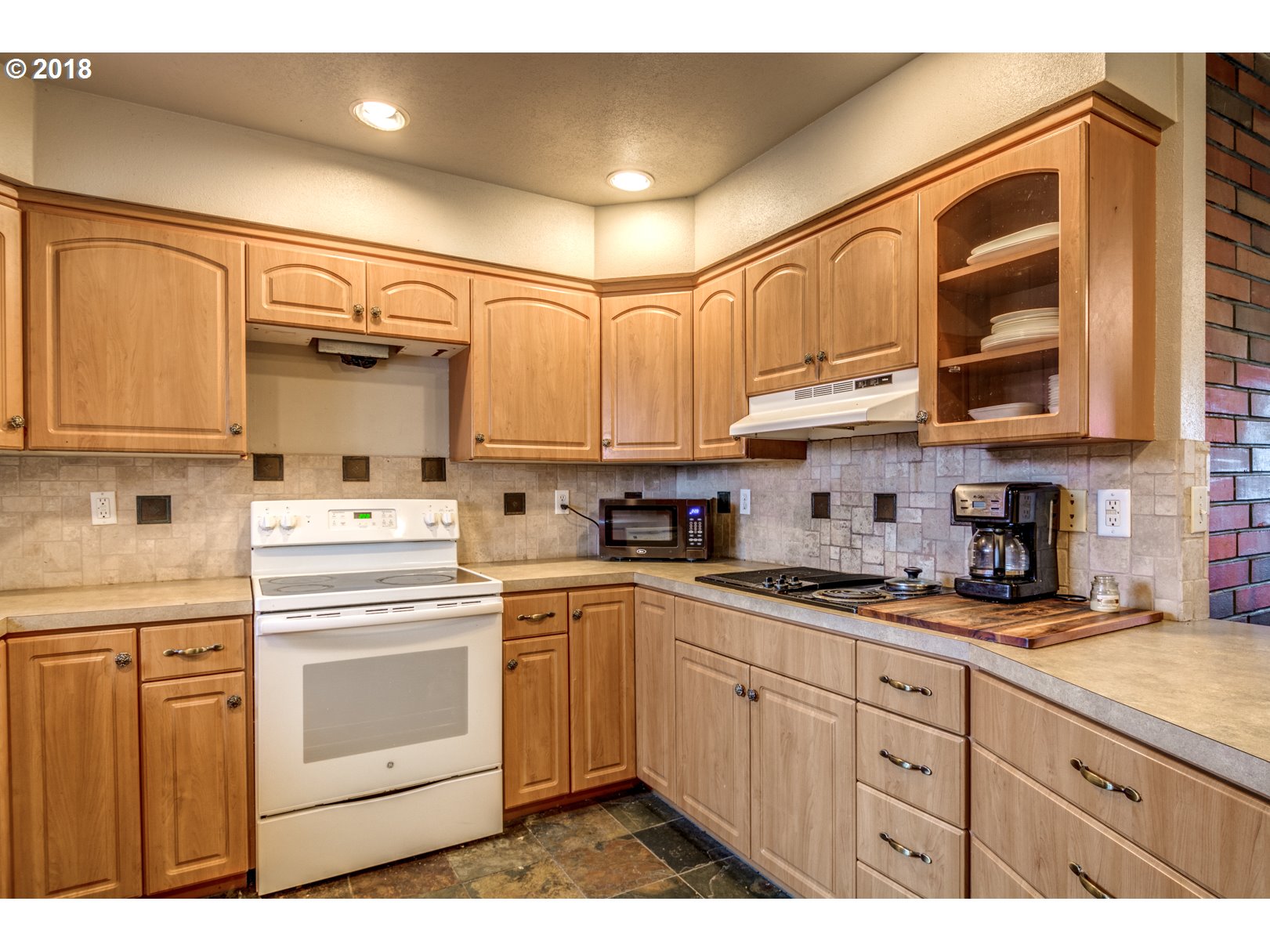 5744 Keene Road Northeast Gervais, OR 97026 - Photo 14 of 32 a kitchen with granite countertop cabinets stainless steel appliances and a sink