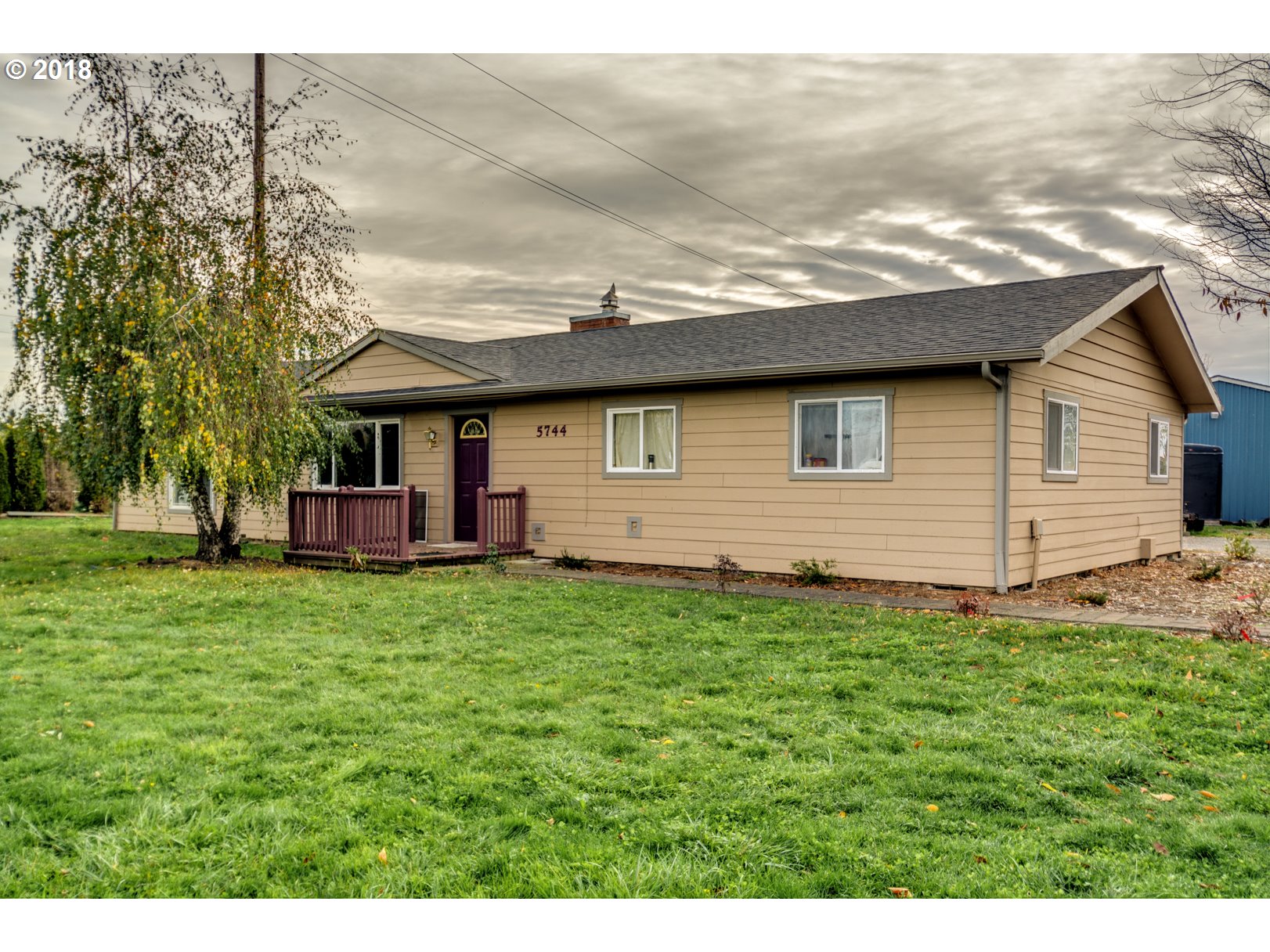 5744 Keene Road Northeast Gervais, OR 97026 - Photo 2 of 32 a backyard of a house with lots of green space