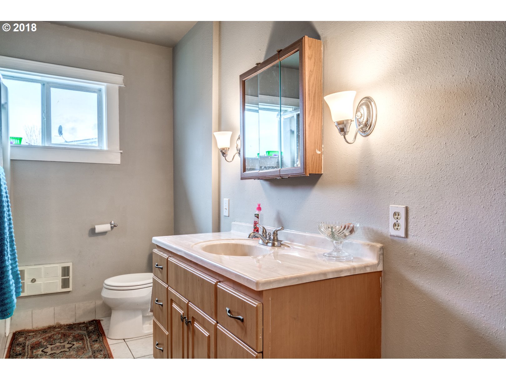 5744 Keene Road Northeast Gervais, OR 97026 - Photo 21 of 32 a bathroom with a sink a toilet and a mirror