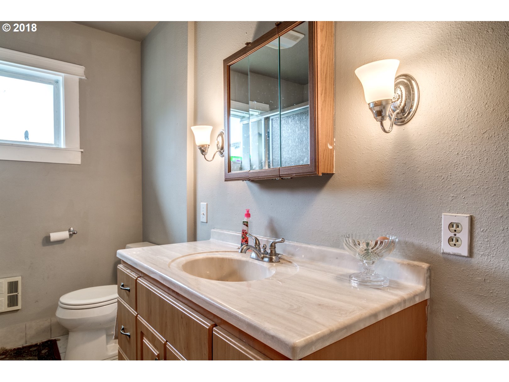 5744 Keene Road Northeast Gervais, OR 97026 - Photo 23 of 32 a bathroom with a sink a mirror and a toilet