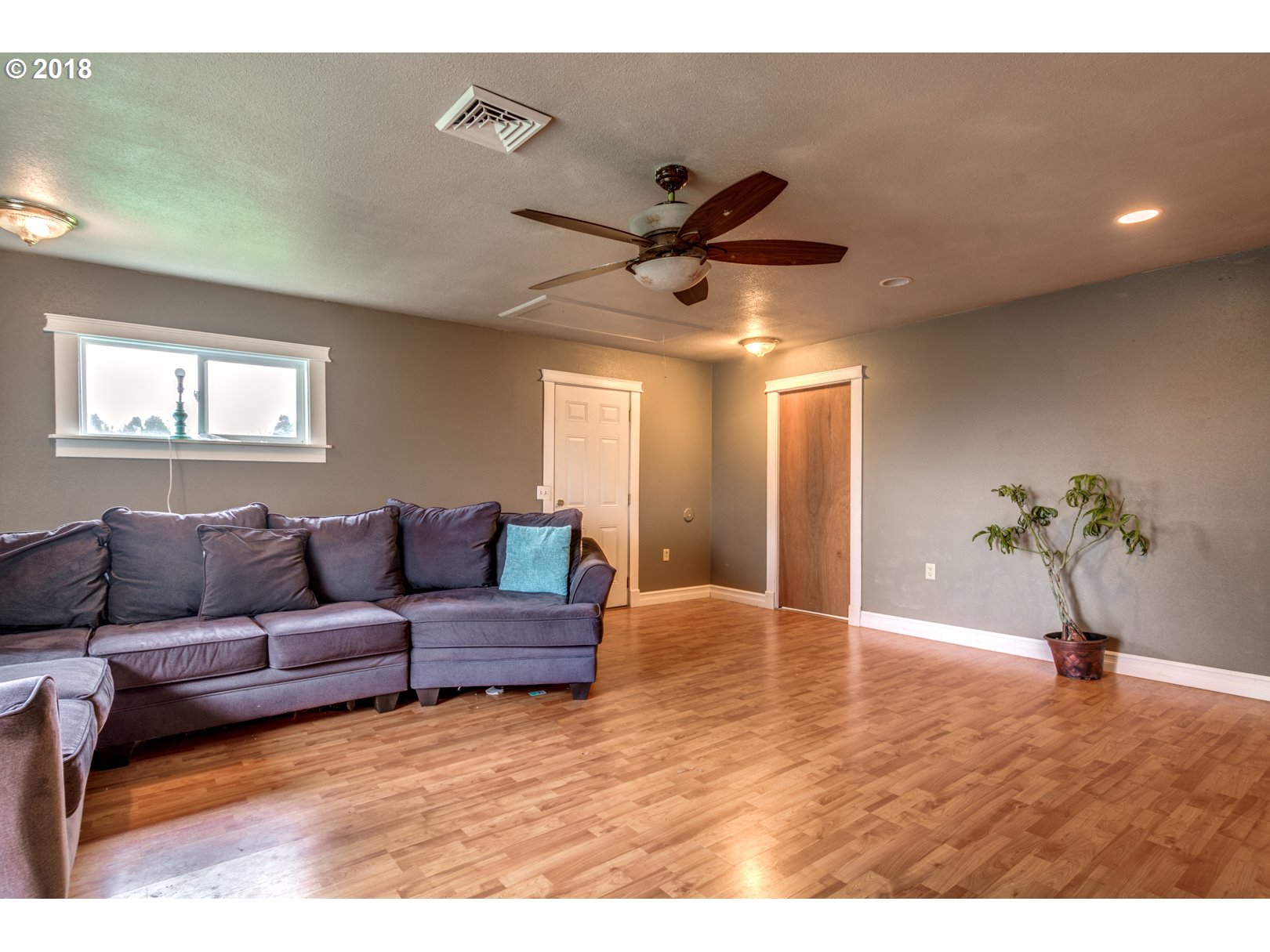 5744 Keene Road Northeast Gervais, OR 97026 - Photo 8 of 32 a living room with furniture and a ceiling fan