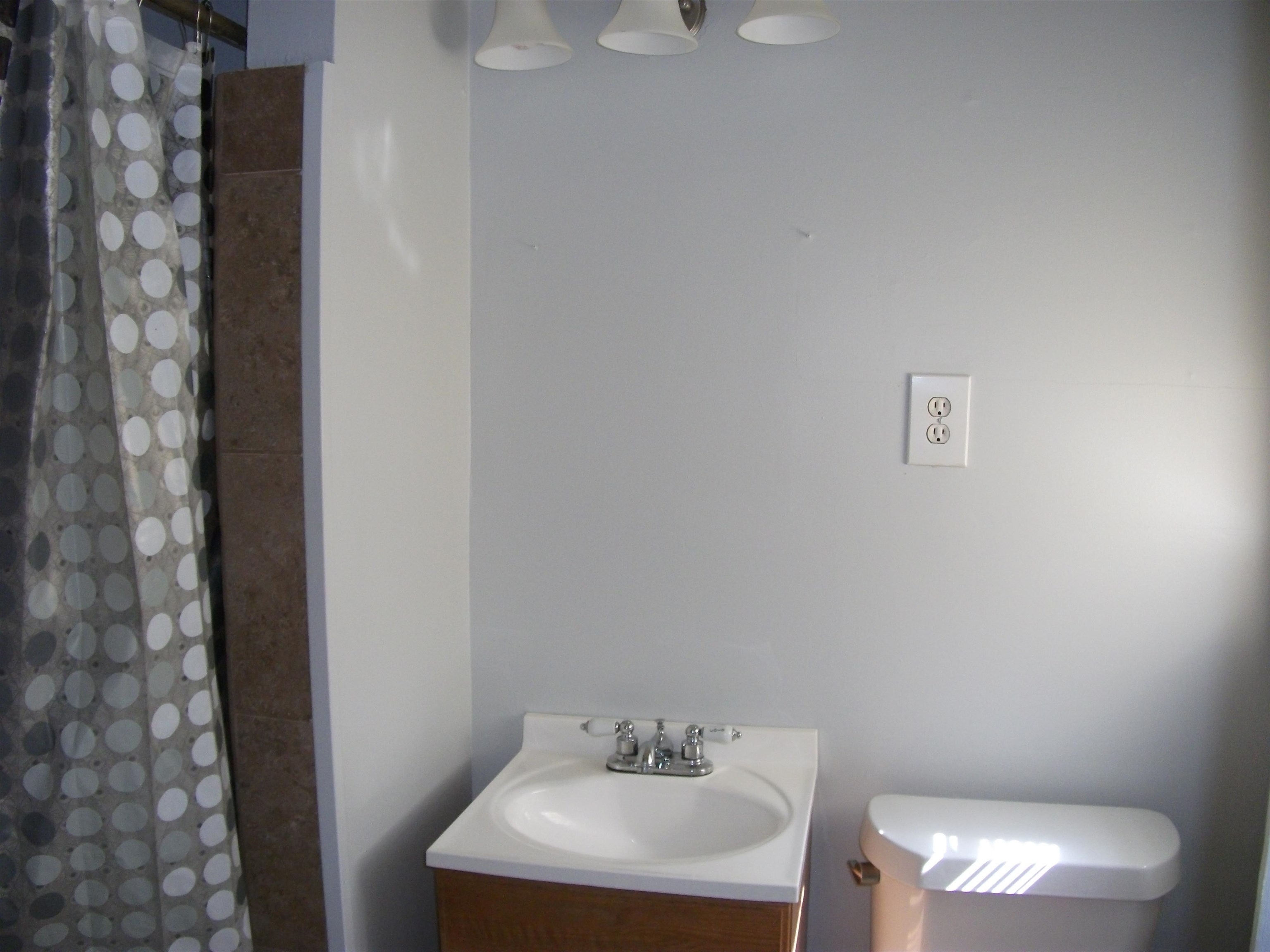 409 Clower Road Memphis, TN 38109 - Photo 6 of 10 a bathroom with a sink and a toilet