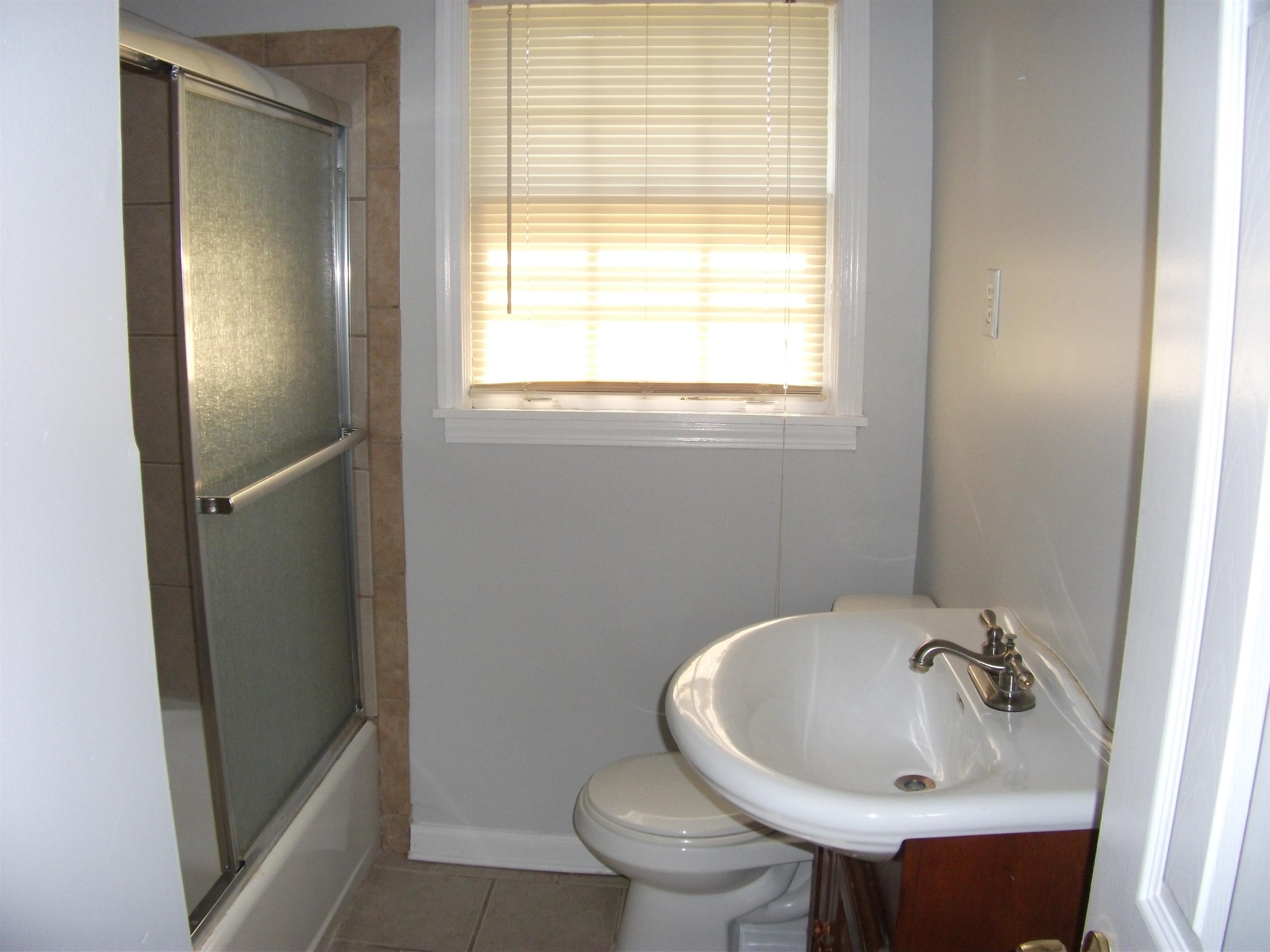 409 Clower Road Memphis, TN 38109 - Photo 8 of 10 a bathroom with a sink and a toilet