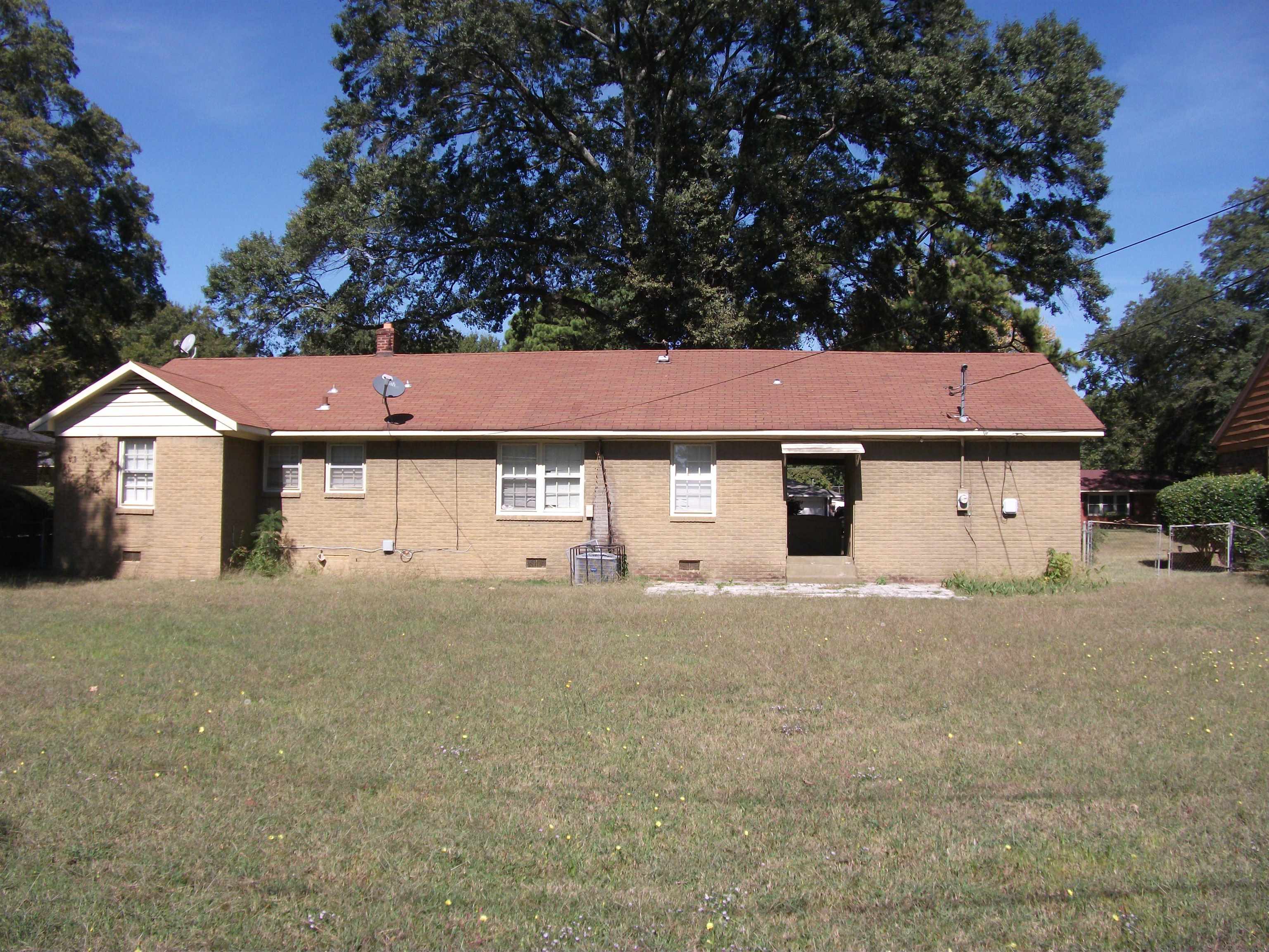 409 Clower Road Memphis, TN 38109 - Photo 10 of 10 a front view of a house with a yard and garage