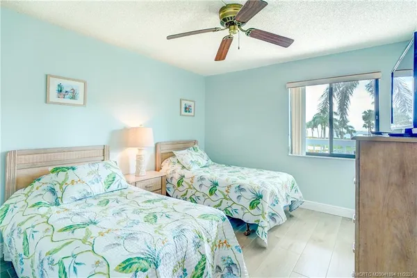 a view of a bedroom with furniture and workspace