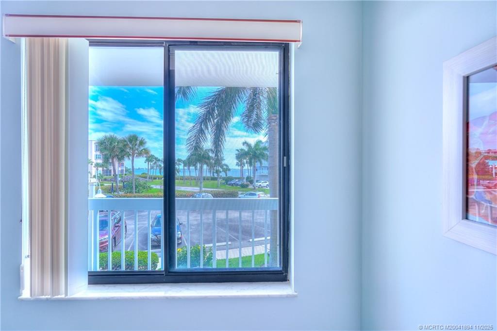 40 Northeast Plantation Road, Unit 209 Stuart, FL 34996 - Photo 13 of 36 a view of a room that has a large window