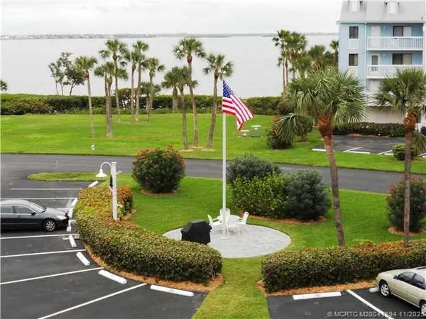 a view of a park with large trees