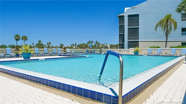 a view of a balcony with yard