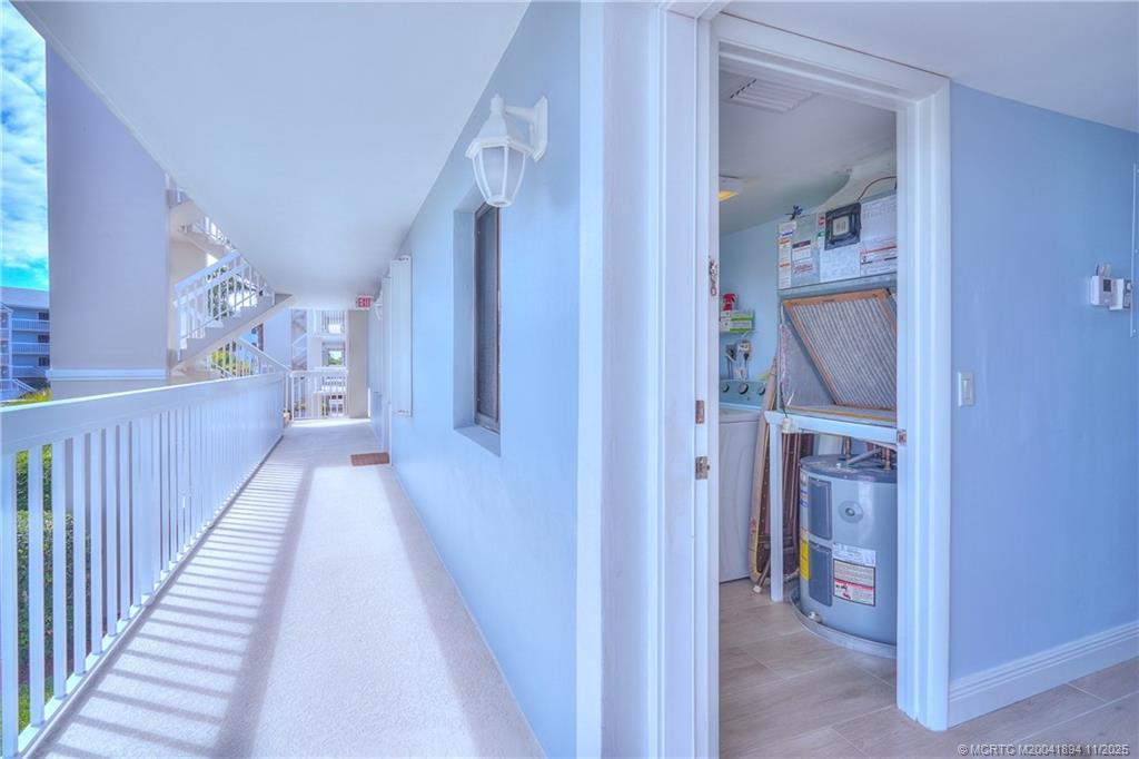 40 Northeast Plantation Road, Unit 209 Stuart, FL 34996 - Photo 32 of 36 a view of a hallway view with staircase