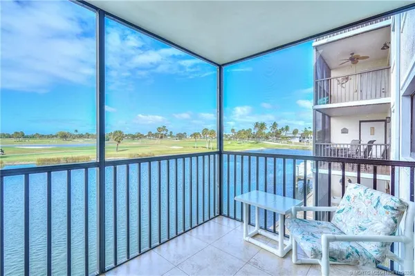 a view of a porch with a floor to ceiling window