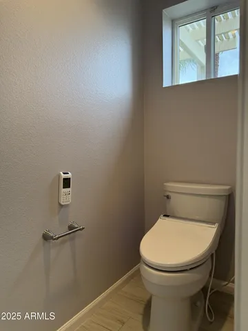 a bathroom with a toilet and a sink