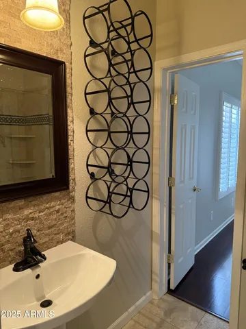 a bathroom with a sink and a mirror