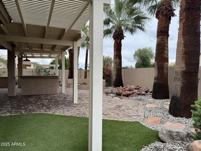 a view of a backyard with potted plants