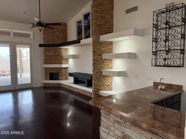 a kitchen with granite countertop a stove and a sink
