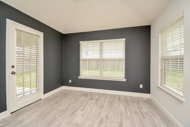 a view of an empty room with a window
