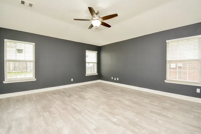 a view of an empty room with a window