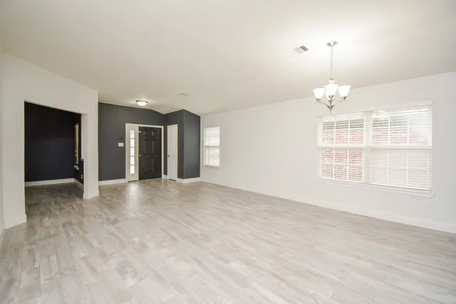 a view of an empty room with a window